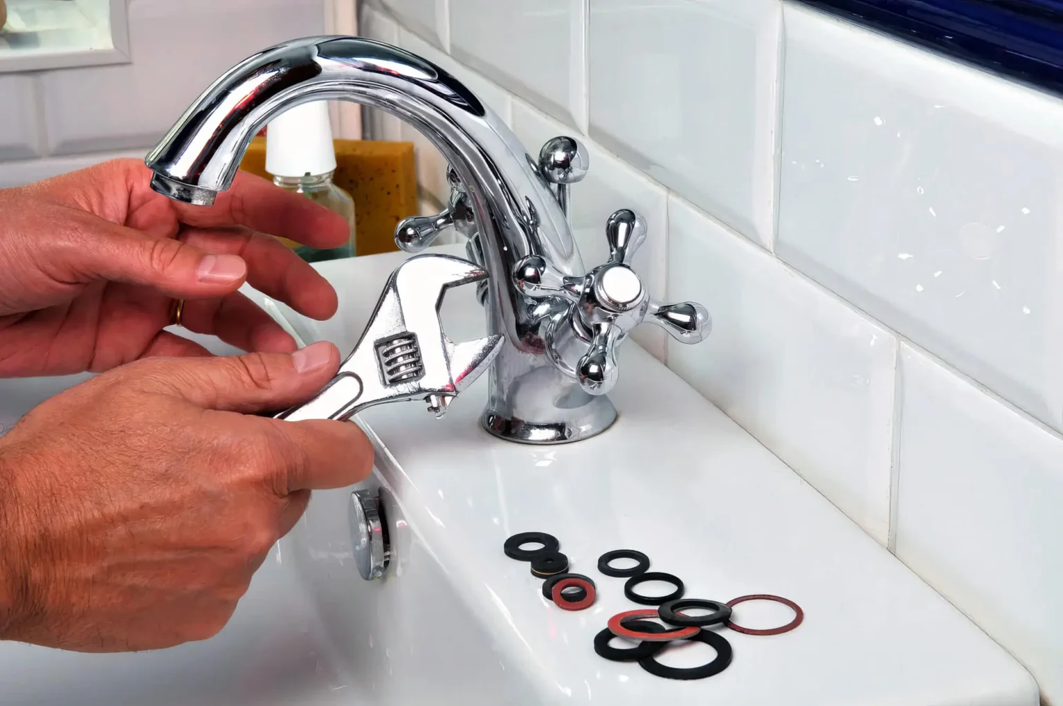 Plumber maintaining a bathroom faucet in Menlo Park