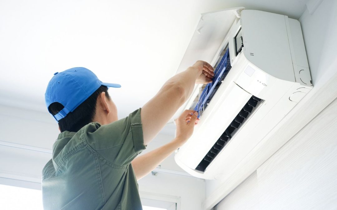 HVAC technician servicing a ductless mini split in Menlo Park