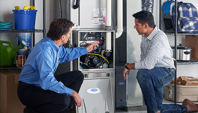 Technician evaluating a furnace for repair or replacement in Menlo Park