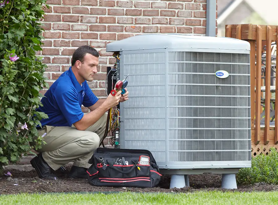 HVAC technician inspecting an outdoor AC unit in Menlo Park