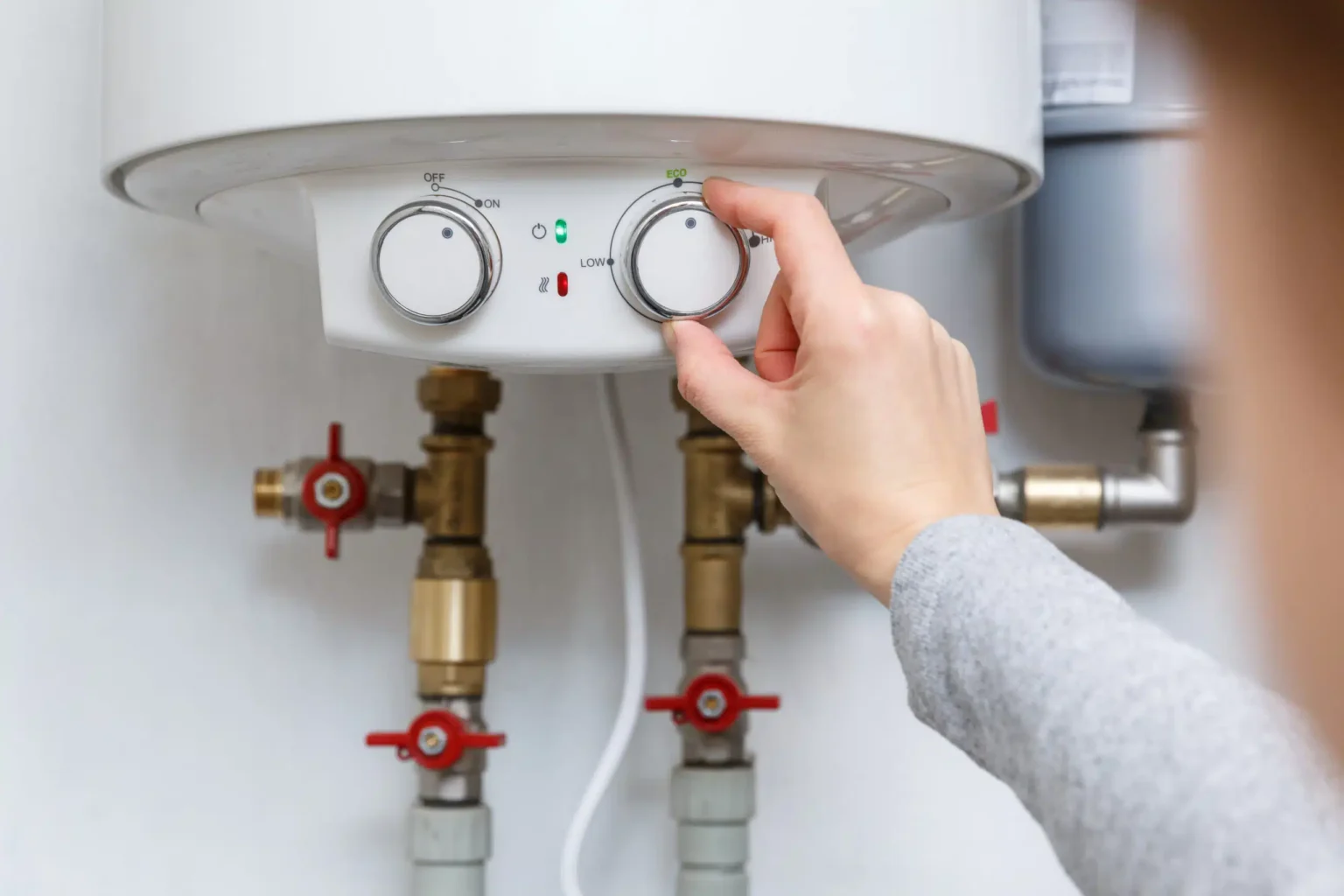 Technician adjusting a water heater in Menlo Park